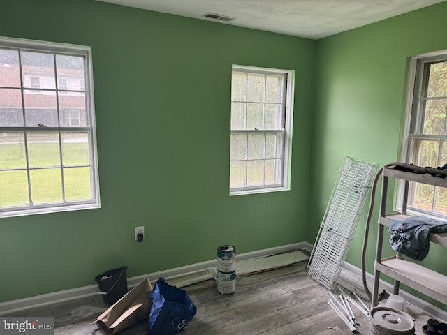 3236 George St, Baltimore, MD 21220 - exercise room with healthy amount of natural light, baseboards, and wood finished floors