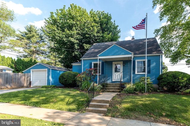 321 Willow Rd, Hellertown, PA 18055 - bungalow-style home featuring driveway, a detached garage, an outdoor structure, covered porch, and roof with shingles