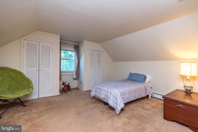 321 Willow Rd, Hellertown, PA 18055 - carpeted bedroom with baseboard heating, two closets, and vaulted ceiling