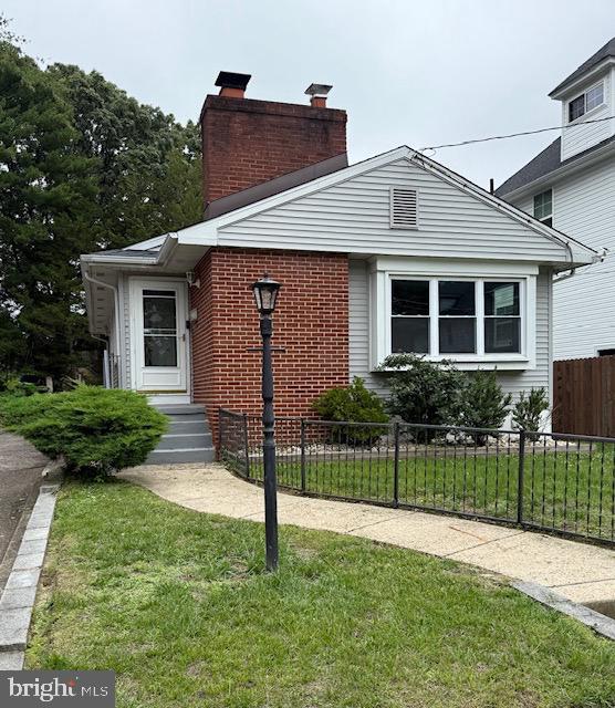 22 E Zane Ave, Collingswood, NJ 08108 - bungalow-style home with a chimney and brick siding
