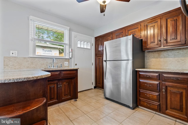 22 E Zane Ave, Collingswood, NJ 08108 - kitchen featuring freestanding refrigerator, a sink, backsplash, and ceiling fan