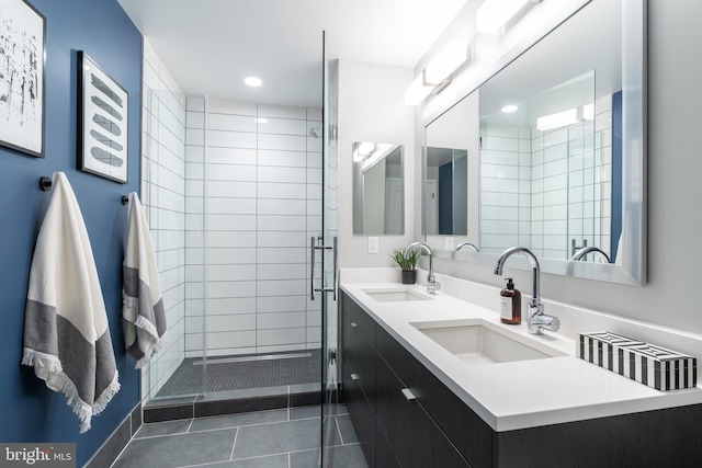 1300 4th St SE Unit 715, Washington, DC 20003 - bathroom featuring tile patterned flooring, double vanity, a stall shower, and recessed lighting
