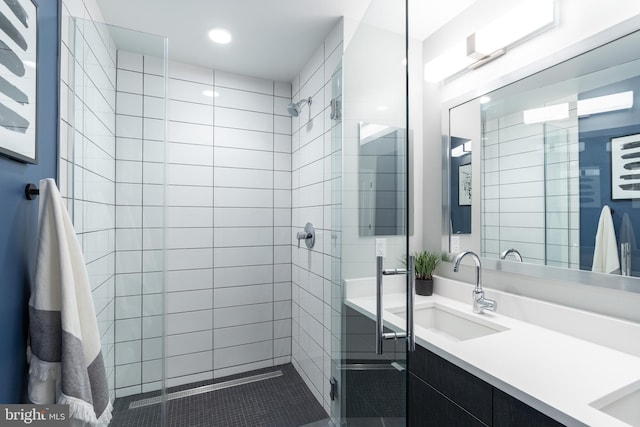 1300 4th St SE Unit 715, Washington, DC 20003 - full bathroom with a shower stall, double vanity, and recessed lighting