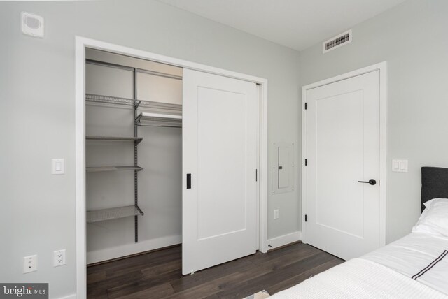 1300 4th St SE Unit 715, Washington, DC 20003 - bedroom with a closet and dark wood finished floors