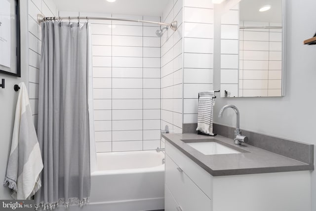 1300 4th St SE Unit 715, Washington, DC 20003 - bathroom featuring vanity, shower / bath combo, and recessed lighting