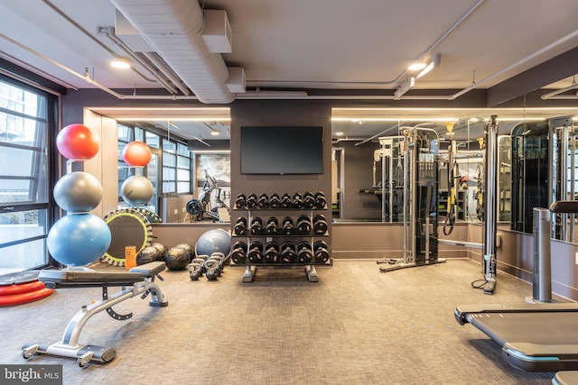 1300 4th St SE Unit 715, Washington, DC 20003 - gym with plenty of natural light and carpet flooring