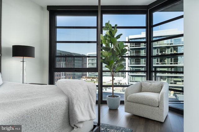 1300 4th St SE Unit 715, Washington, DC 20003 - bedroom featuring floor to ceiling windows and wood finished floors
