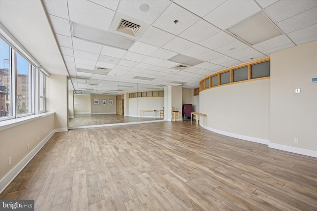 1100 Vine St Unit 1409, Philadelphia, PA 19107 - unfurnished living room featuring wood finished floors and a paneled ceiling