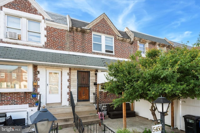5450 Erdrick St, Philadelphia, PA 19124 - view of property featuring brick siding and cooling unit