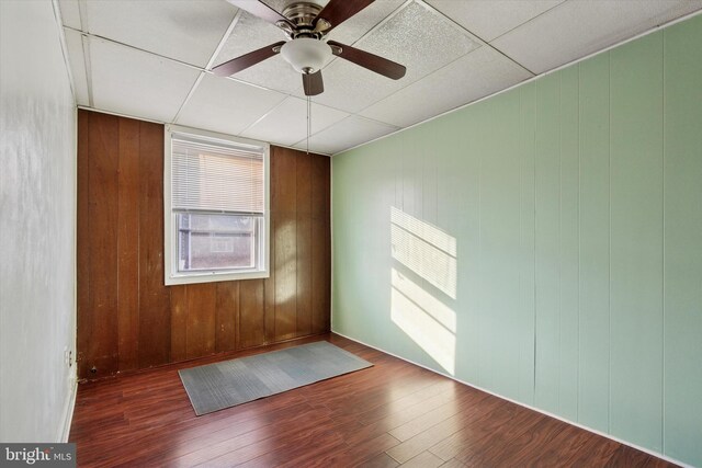 5450 Erdrick St, Philadelphia, PA 19124 - spare room with wood finished floors, a ceiling fan, and wood walls