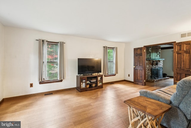 13 Plymouth, Tabernacle, NJ 08088 - living area with wood finished floors and a wood stove
