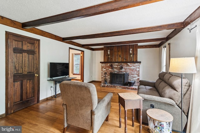 13 Plymouth, Tabernacle, NJ 08088 - living area with beam ceiling, wood finished floors, a textured ceiling, and a fireplace