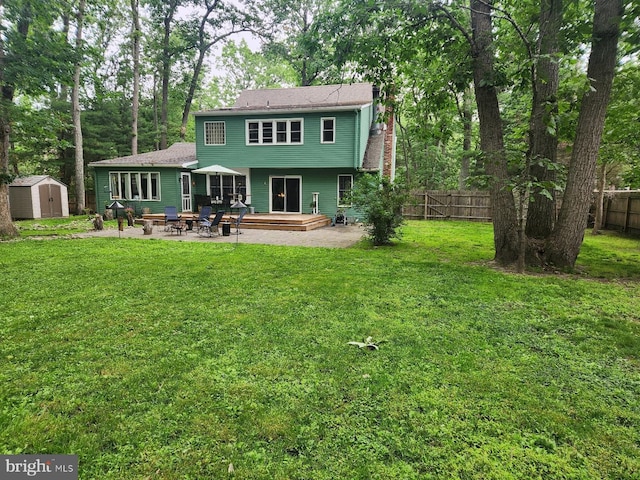 13 Plymouth, Tabernacle, NJ 08088 - back of property with a patio area, a storage shed, and a fenced backyard