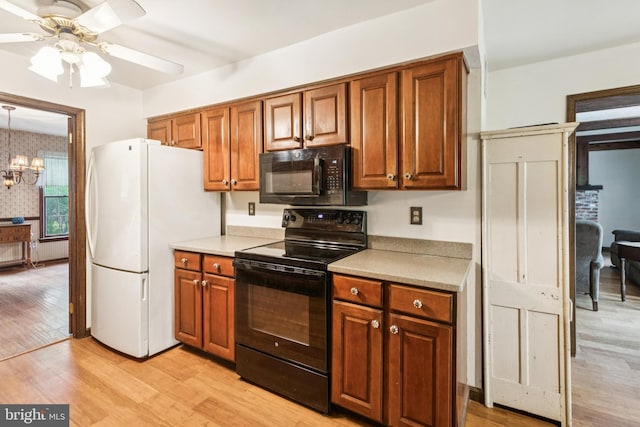 13 Plymouth, Tabernacle, NJ 08088 - kitchen featuring black appliances, a ceiling fan, light wood-style flooring, and brown cabinetry