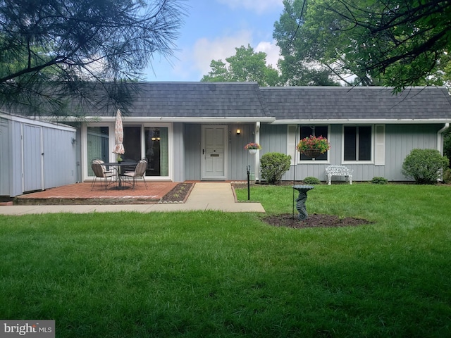 15000 Candover Ct Unit 278-B, Silver Spring, MD 20906 - view of front of home featuring a shingled roof, a front yard, board and batten siding, and mansard roof
