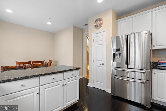 8878 Ashgrove House Ln, Vienna, VA 22182 - kitchen with stainless steel refrigerator with ice dispenser, white cabinets, dark wood-style flooring, dark stone countertops, and recessed lighting