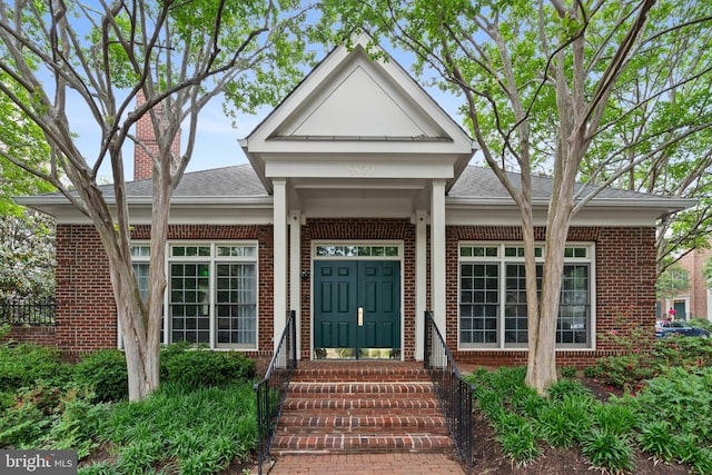 8878 Ashgrove House Ln, Vienna, VA 22182 - entrance to property featuring brick siding and roof with shingles