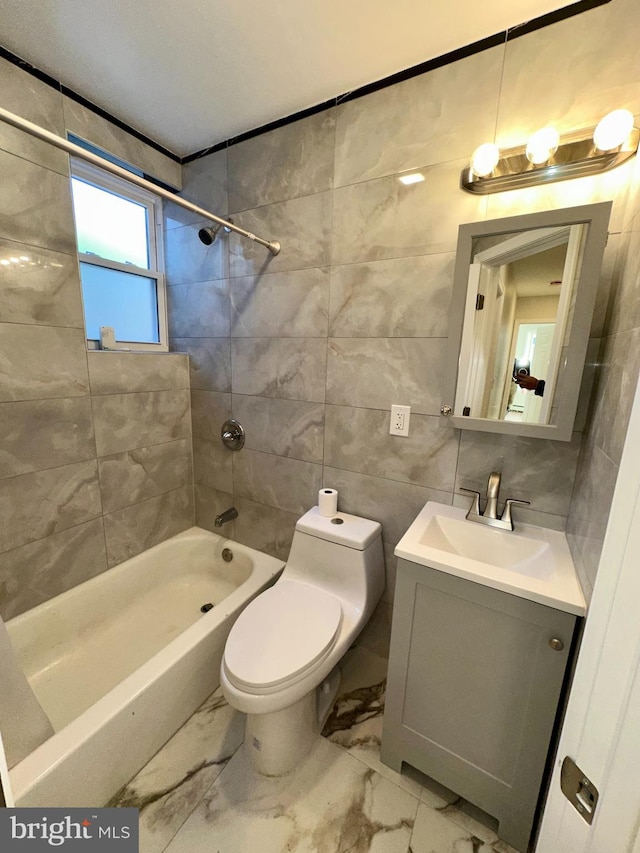 205 W Wishart St, Philadelphia, PA 19133 - bathroom with shower / tub combination, marble finish floors, vanity, toilet, and tile walls