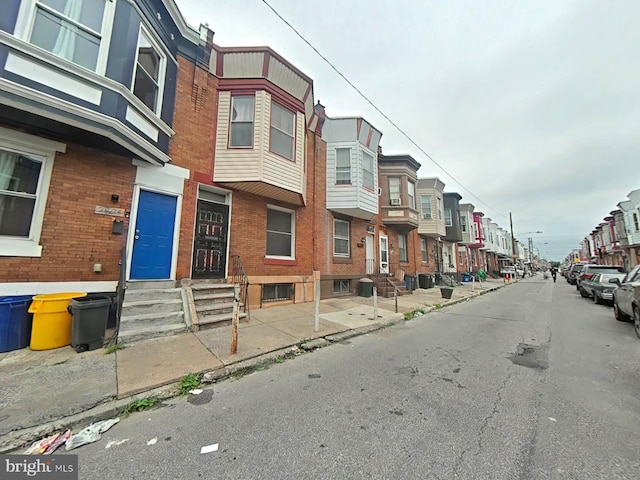 2828 N Stillman St, Philadelphia, PA 19132 - view of asphalt street featuring a residential view, curbs, street lighting, and sidewalks