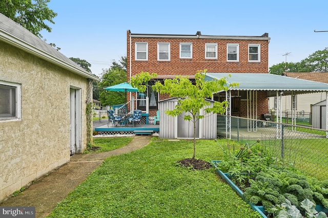 110 S Marlyn Ave, Essex, MD 21221 - rear view of house featuring a storage unit and a wooden deck