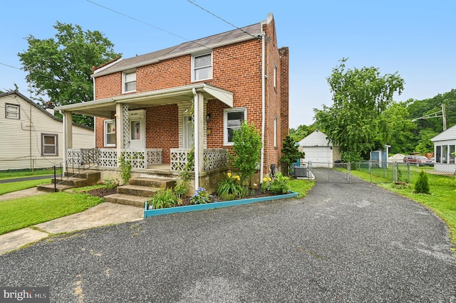 110 S Marlyn Ave, Essex, MD 21221 - view of front of house featuring brick siding, covered porch, and a detached garage