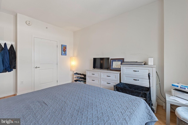 155 Potomac Psge Unit 817, Oxon Hill, MD 20745 - bedroom featuring baseboards and wood finished floors