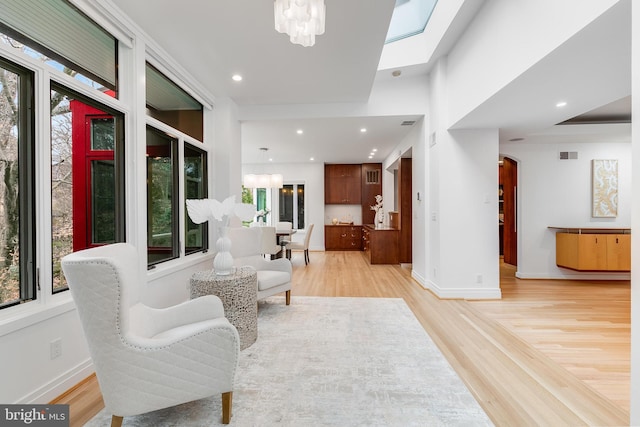 2950 Macomb St NW, Washington, DC 20008 - living area featuring plenty of natural light, light wood-style flooring, baseboards, and recessed lighting