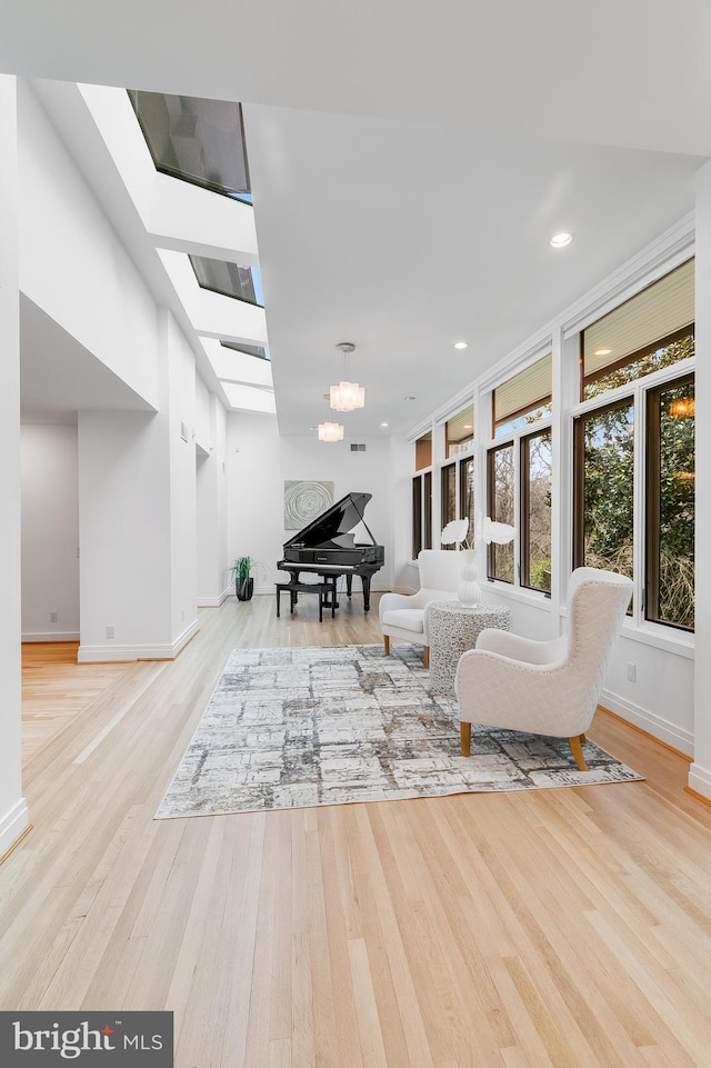 2950 Macomb St NW, Washington, DC 20008 - living area featuring baseboards, wood finished floors, a chandelier, and recessed lighting