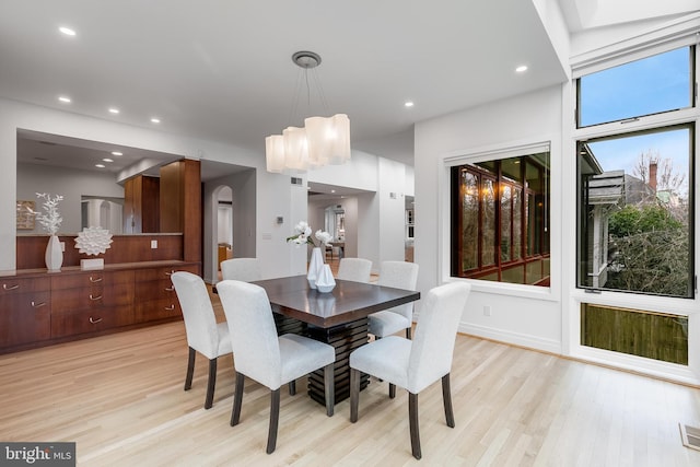 2950 Macomb St NW, Washington, DC 20008 - dining area with light wood finished floors, recessed lighting, and arched walkways