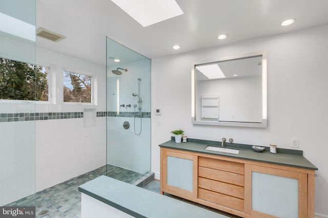 2950 Macomb St NW, Washington, DC 20008 - bathroom with a skylight, a walk in shower, vanity, and recessed lighting