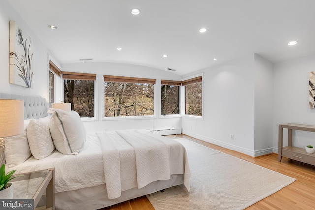 2950 Macomb St NW, Washington, DC 20008 - bedroom featuring a baseboard heating unit, baseboards, wood finished floors, and recessed lighting