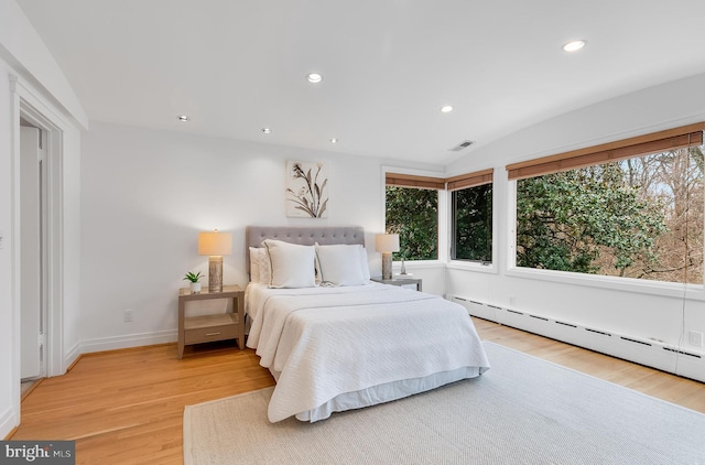 2950 Macomb St NW, Washington, DC 20008 - bedroom featuring light wood-style floors, baseboard heating, recessed lighting, vaulted ceiling, and baseboards