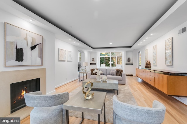 2950 Macomb St NW, Washington, DC 20008 - living area with light wood finished floors, recessed lighting, a premium fireplace, arched walkways, and a raised ceiling