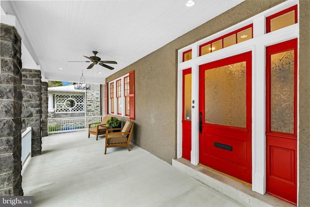 2950 Macomb St NW, Washington, DC 20008 - view of exterior entry featuring covered porch, a ceiling fan, stucco siding, and elevator