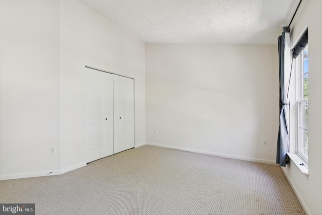 8309 Pigeon Fork Ln, Laurel, MD 20724 - unfurnished bedroom featuring carpet floors, a textured ceiling, and a closet