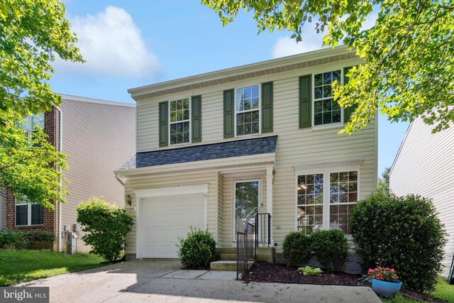 8309 Pigeon Fork Ln, Laurel, MD 20724 - view of front of home featuring a garage, driveway, and roof with shingles