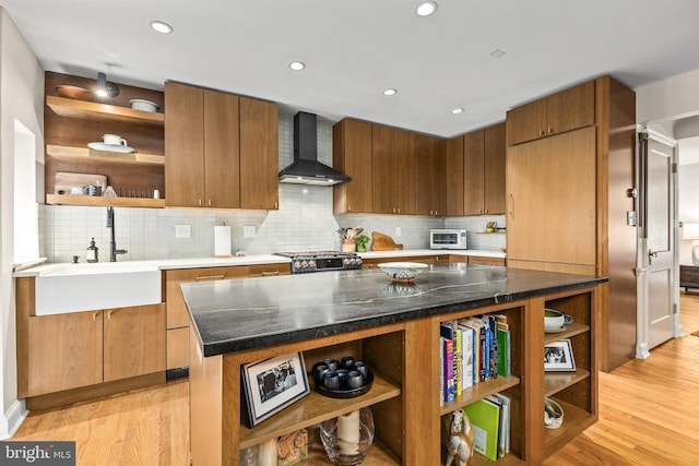 1850 Irving St NW, Washington, DC 20010 - kitchen featuring open shelves, wall chimney exhaust hood, light wood-type flooring, backsplash, and recessed lighting