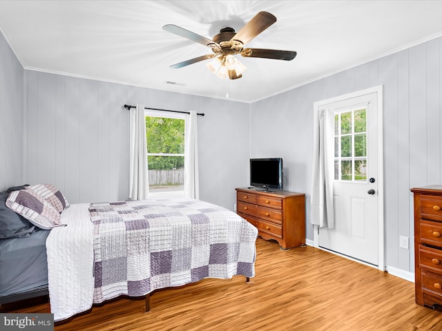 213 S 6th St, Denton, MD 21629 - bedroom with light wood-type flooring, crown molding, and ceiling fan