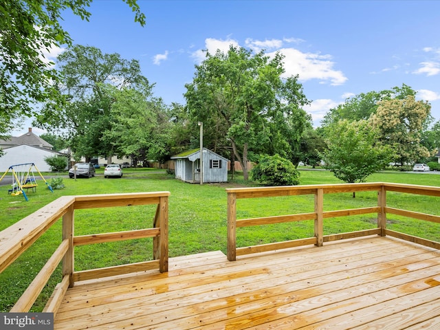 213 S 6th St, Denton, MD 21629 - deck featuring a yard, a shed, and a playground
