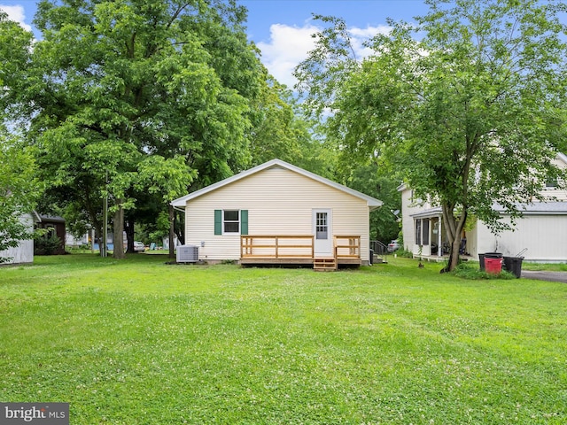 213 S 6th St, Denton, MD 21629 - rear view of property featuring a deck and a yard
