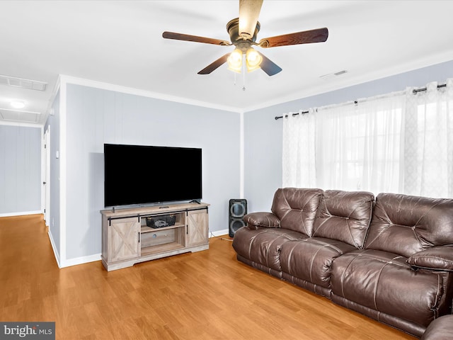 213 S 6th St, Denton, MD 21629 - living room featuring light wood finished floors, a ceiling fan, attic access, and crown molding