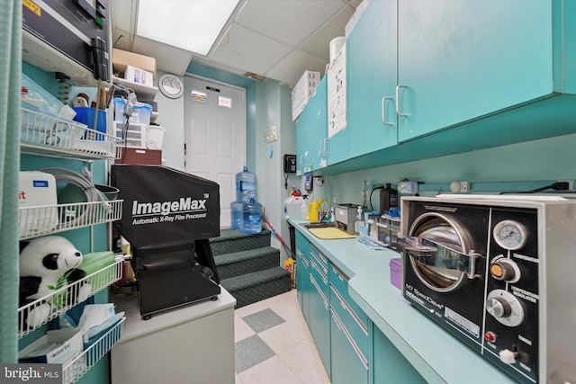 3 W Gowen Ave, Philadelphia, PA 19119 - kitchen with light flooring, blue cabinets, and light countertops