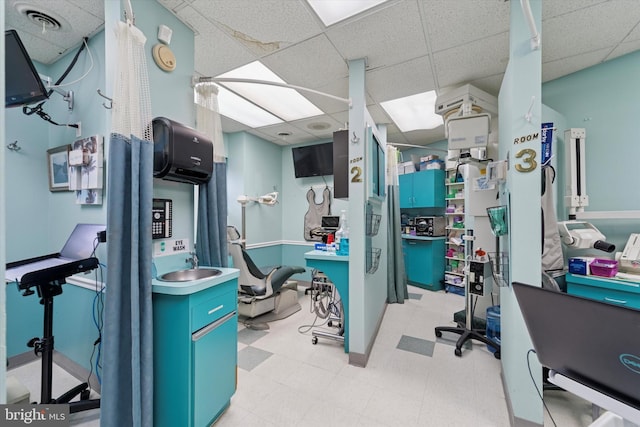 3 W Gowen Ave, Philadelphia, PA 19119 - office area featuring a paneled ceiling, light flooring, and baseboards
