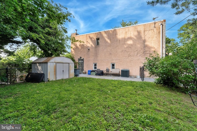 3 W Gowen Ave, Philadelphia, PA 19119 - back of property featuring stucco siding, a patio area, and cooling unit