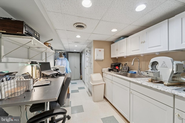 3 W Gowen Ave, Philadelphia, PA 19119 - kitchen with a sink, light flooring, white cabinetry, a drop ceiling, and recessed lighting