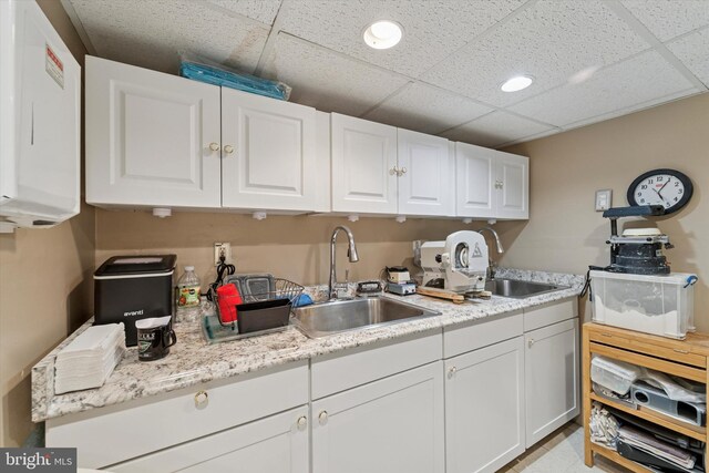3 W Gowen Ave, Philadelphia, PA 19119 - kitchen with a sink, white cabinetry, light countertops, a drop ceiling, and recessed lighting