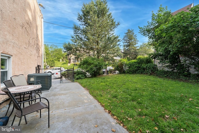 3 W Gowen Ave, Philadelphia, PA 19119 - view of yard with central air condition unit, a patio area, and a gate
