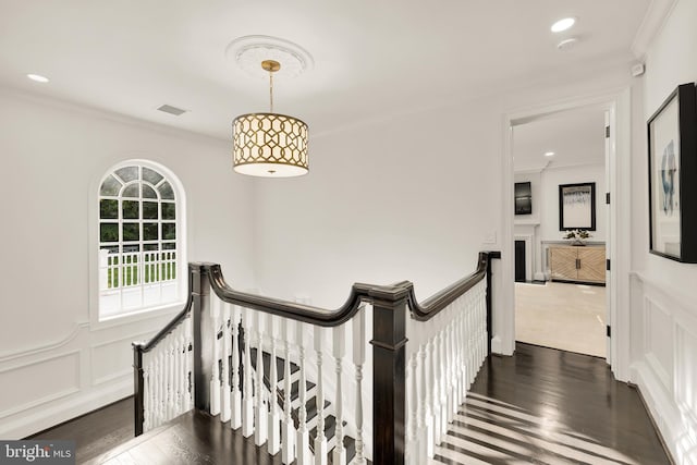 13300 Manor Stone Dr, Darnestown, MD 20874 - hallway featuring a decorative wall, an upstairs landing, dark wood-style flooring, ornamental molding, and a wainscoted wall