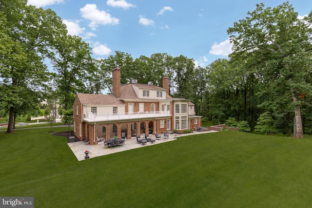 13300 Manor Stone Dr, Darnestown, MD 20874 - rear view of house with a patio, a yard, a chimney, and brick siding