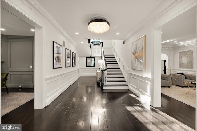 13300 Manor Stone Dr, Darnestown, MD 20874 - foyer featuring a decorative wall, stairway, dark wood-type flooring, ornamental molding, and a chandelier